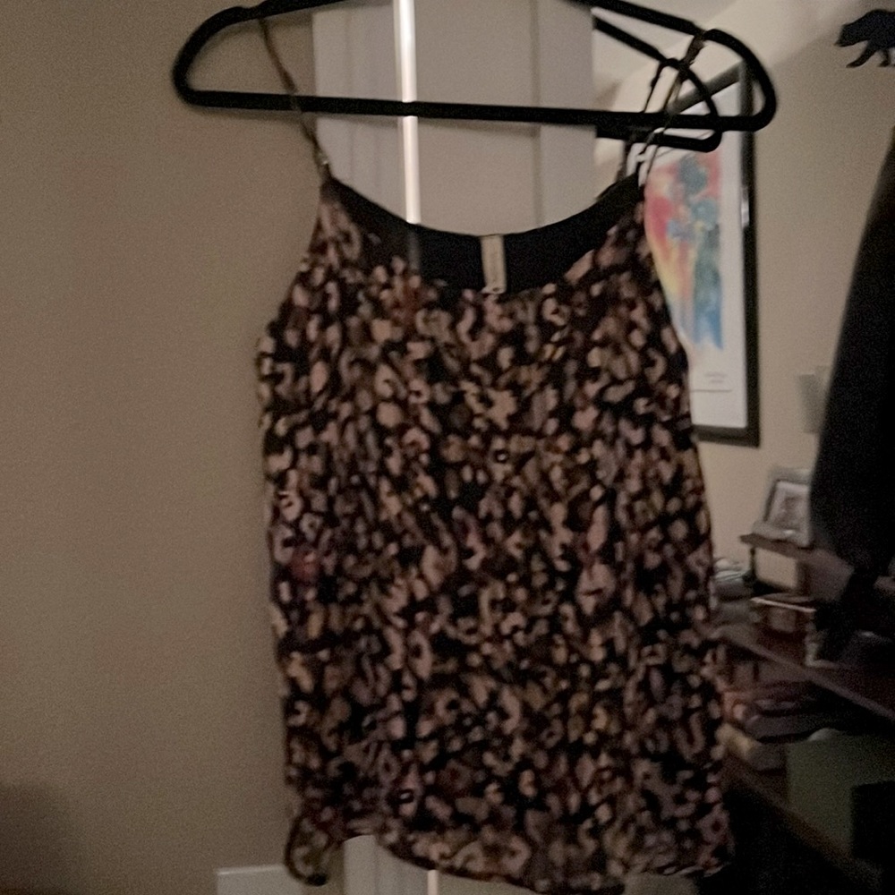 New never worn. Pink and black print beautiful top with adjustable straps